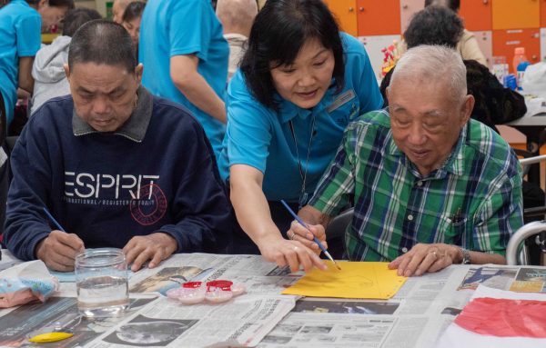 International Friendship Day - Mr Yeo and Mr Aw doing art together