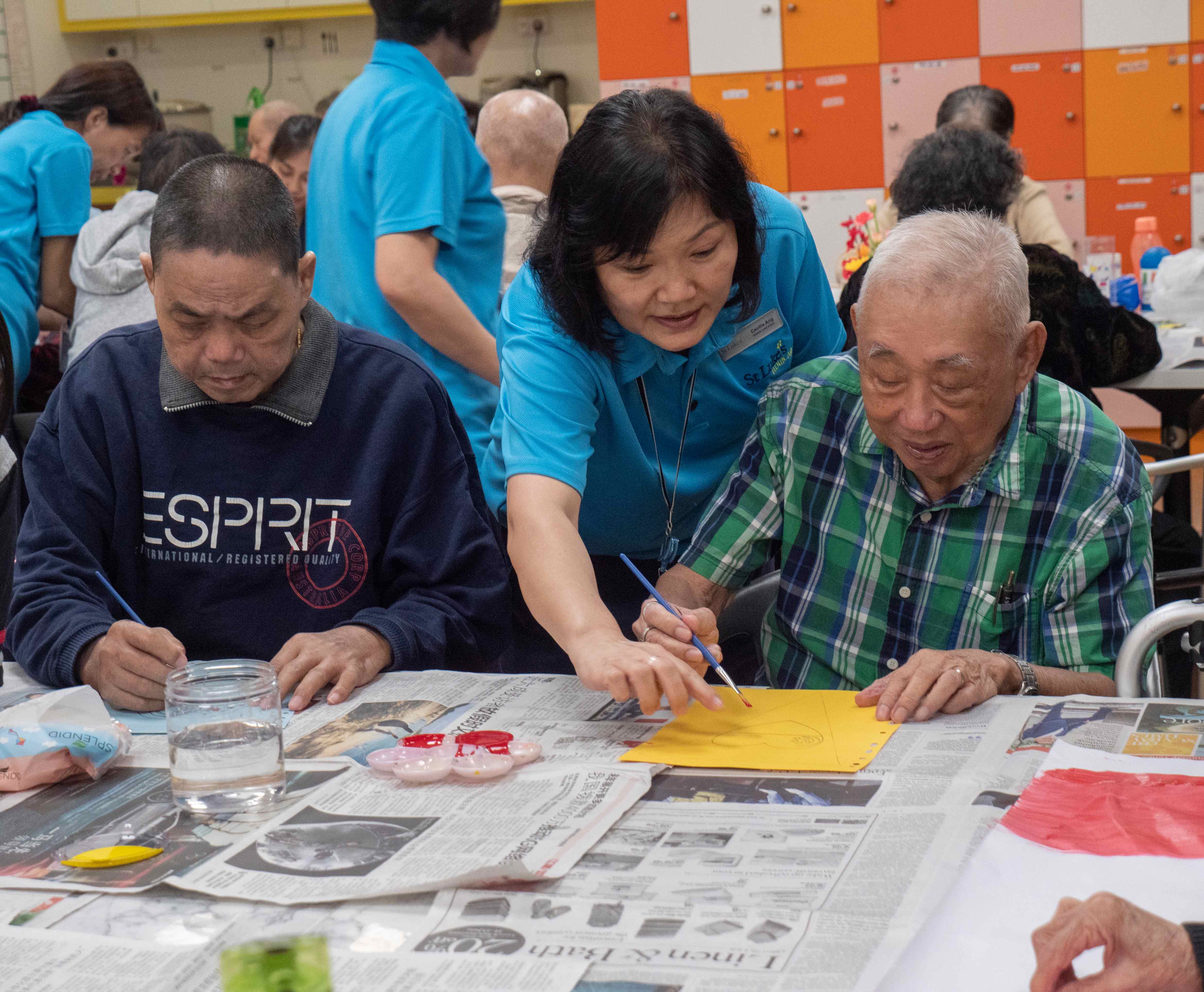 International Friendship Day - Mr Yeo and Mr Aw doing art together