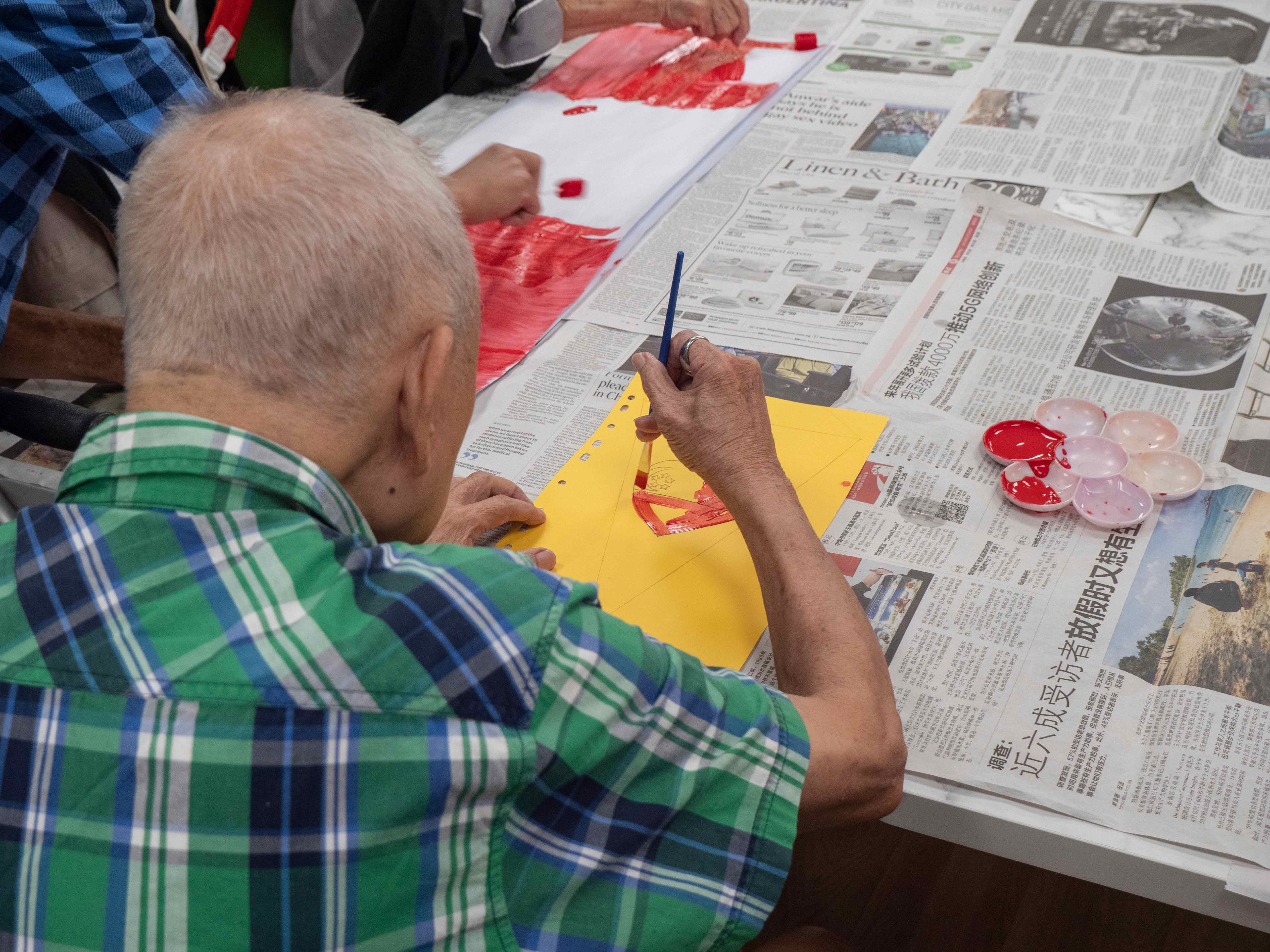 Mr Yeo doing art at St Luke's ElderCare Hougang Meadow Centre